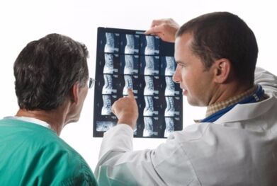 Doctor looks spinal cord